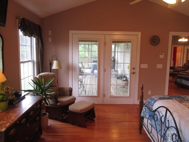 7761 Shoals Branch Road Primm Springs, TN 38476 - Photo 8 of 20 You'll love walking out on to the covered deck from this door in the Mstr Bedroom. This would be a great place for a hot tub!