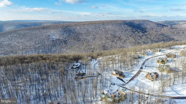 a view of roof with mountain view