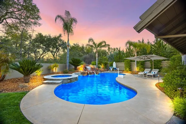 a view of a swimming pool with a patio