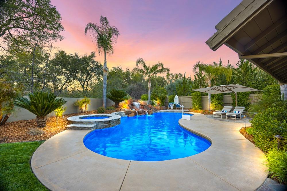 a view of a swimming pool with a patio