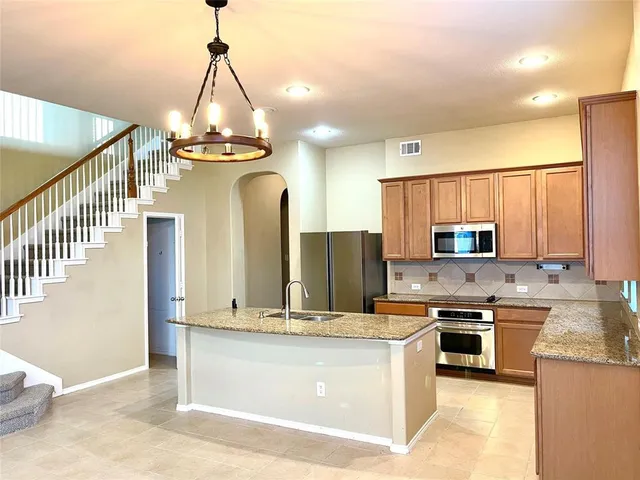 a view of an empty room with windows