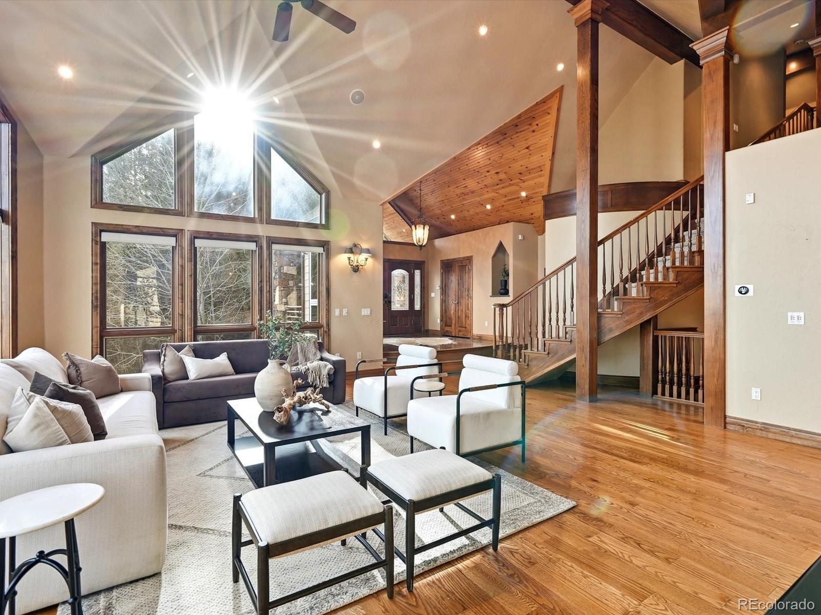 187 Fox Ridge Drive Evergreen, CO 80439 - Photo 11 of 49 a living room with furniture and a large window