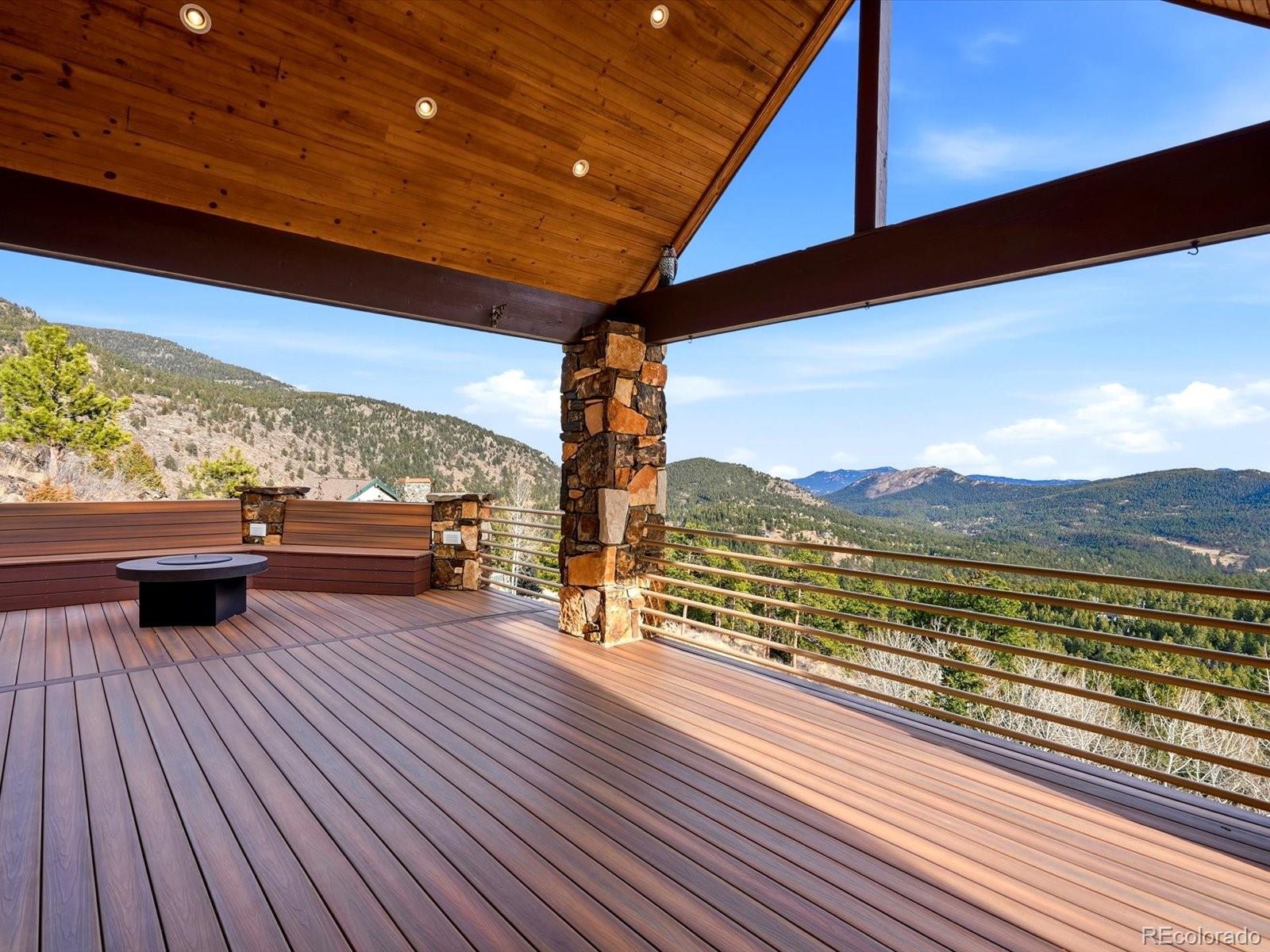 187 Fox Ridge Drive Evergreen, CO 80439 - Photo 17 of 49 a view of a balcony with wooden floor