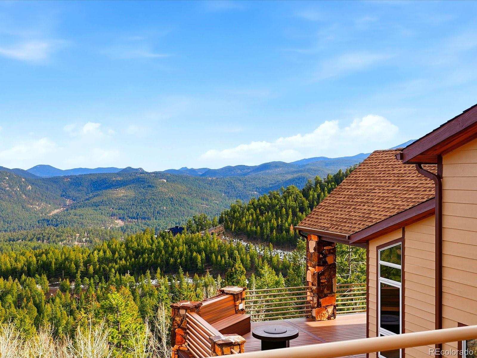 187 Fox Ridge Drive Evergreen, CO 80439 - Photo 3 of 50 a view of house with mountain view
