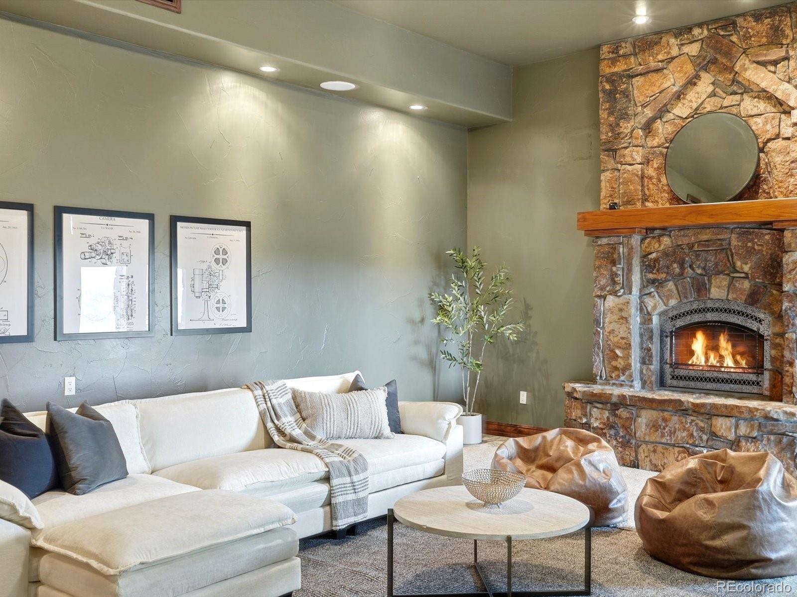 187 Fox Ridge Drive Evergreen, CO 80439 - Photo 41 of 49 a living room with furniture and a fireplace