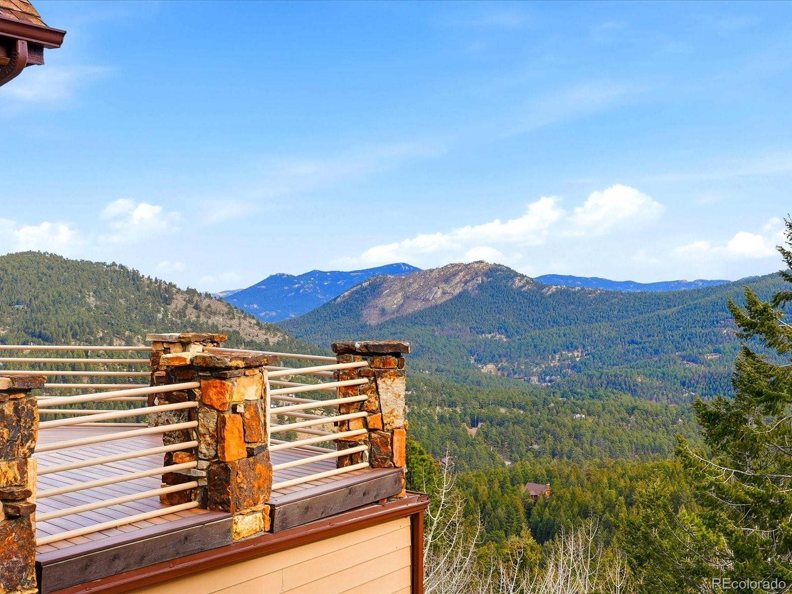 187 Fox Ridge Drive Evergreen, CO 80439 - Photo 46 of 49 a view of a balcony with an outdoor space and lakeside