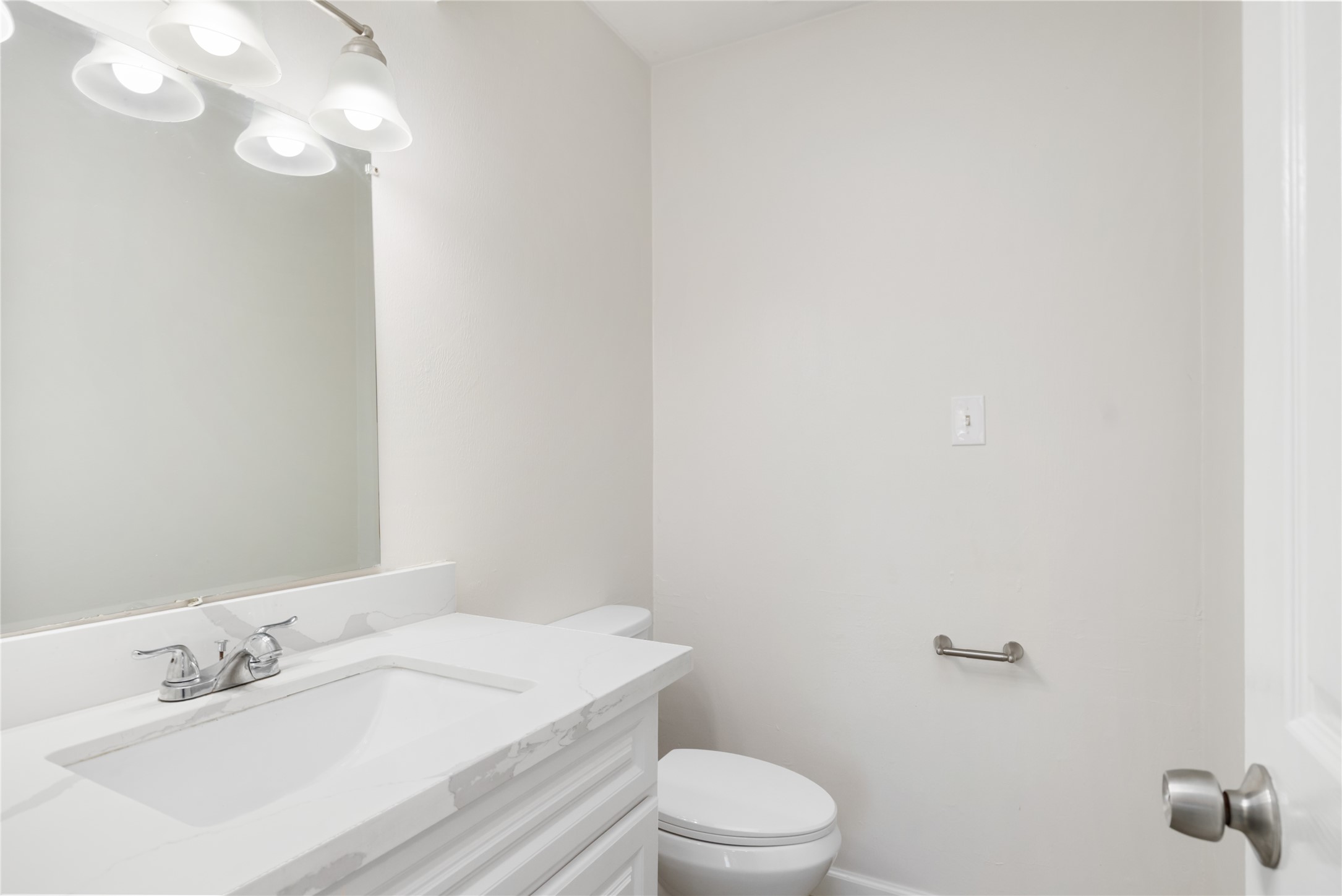 24118 Spring Mill Lane Spring, TX 77373 - Photo 14 of 24 a bathroom with a sink vanity mirror and toilet