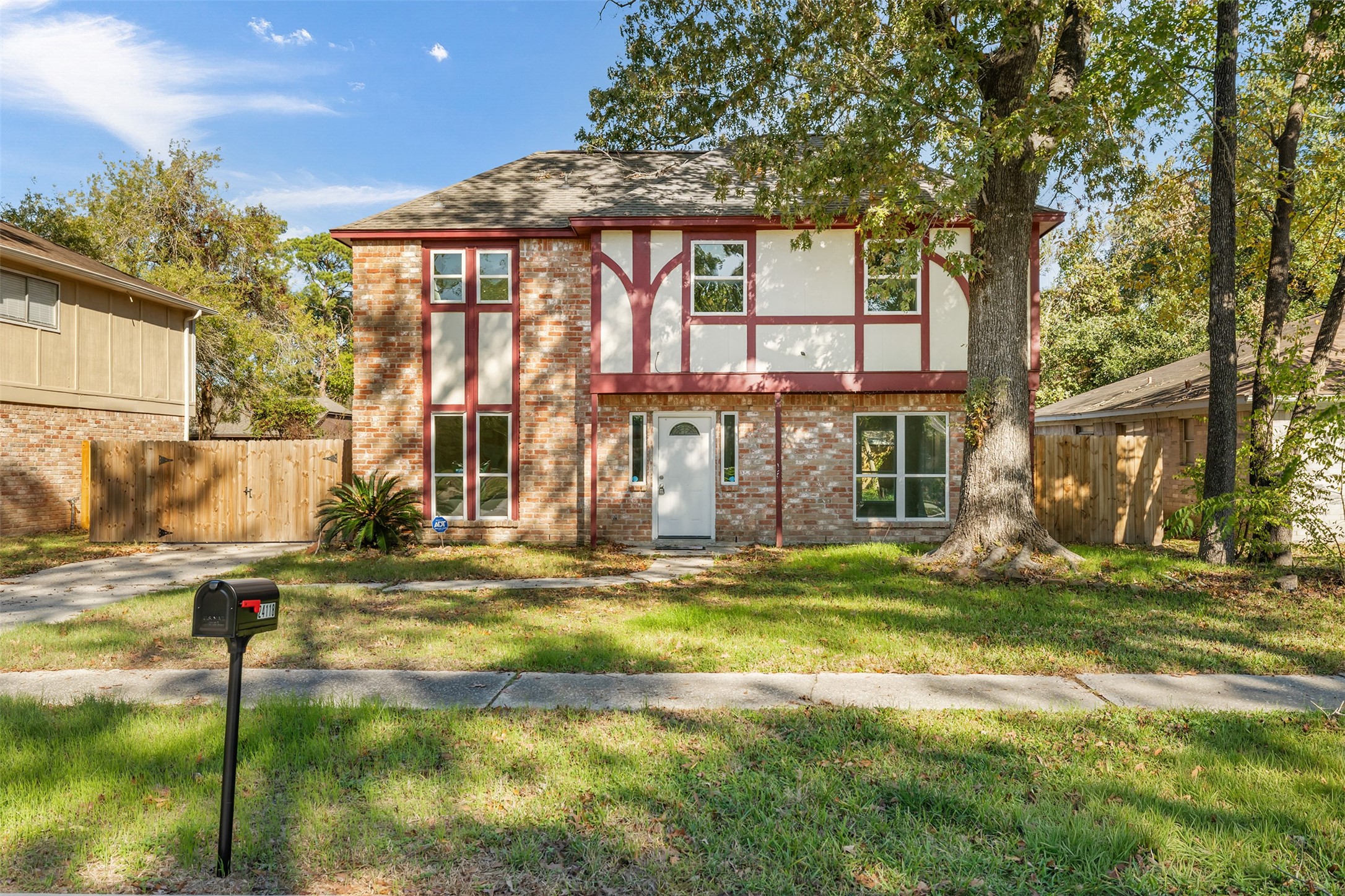 24118 Spring Mill Lane Spring, TX 77373 - Photo 2 of 24 a view of a house with a yard and sitting area