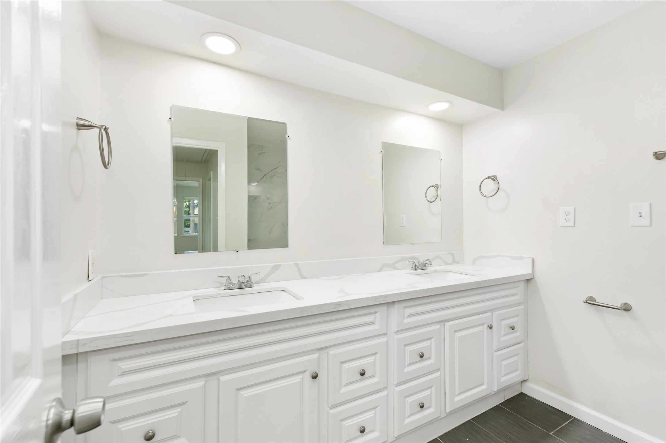 24118 Spring Mill Lane Spring, TX 77373 - Photo 21 of 24 a bathroom with double sink and a mirror