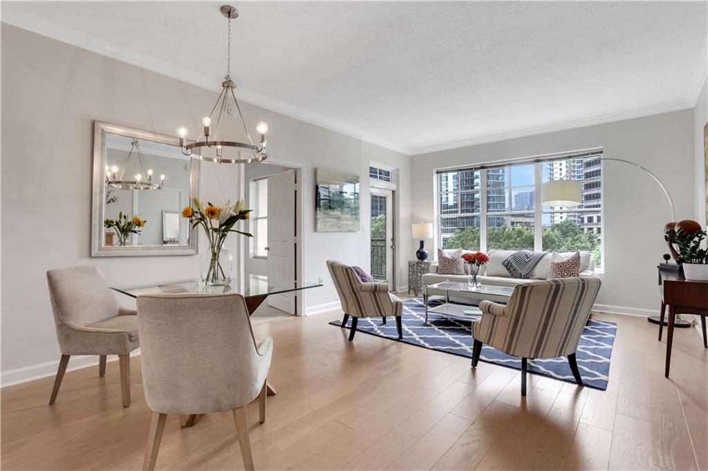 1101 Juniper Street Northeast, Unit 619 Atlanta, GA 30309 - Photo 1 of 28 a view of a dining room with furniture window and wooden floor