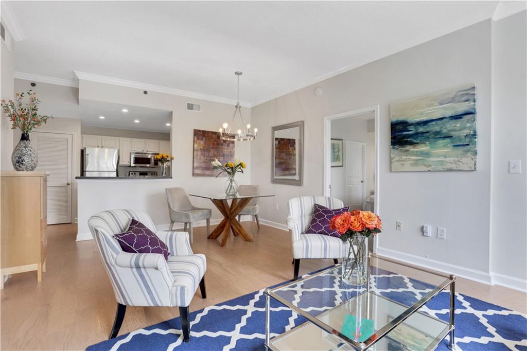 1101 Juniper Street Northeast, Unit 619 Atlanta, GA 30309 - Photo 12 of 28 a living room with furniture and wooden floor