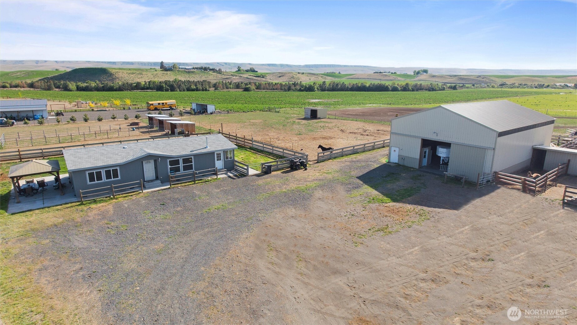 an aerial view of a house with a big yard