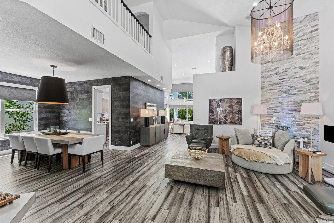 3395 Northwest 53rd Circle Boca Raton, FL 33496 - Photo 4 of 64 a living room with furniture and a wooden floor