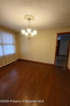 a kitchen with stainless steel appliances granite countertop wooden cabinets a refrigerator and a stove