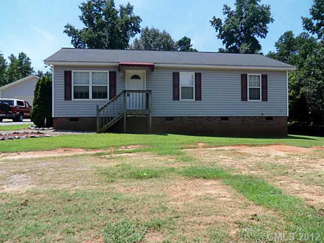 4841 Old Hickory Road, Unit 1 Lancaster, SC 29720 - Photo 1 of 11 a front view of a house with a yard