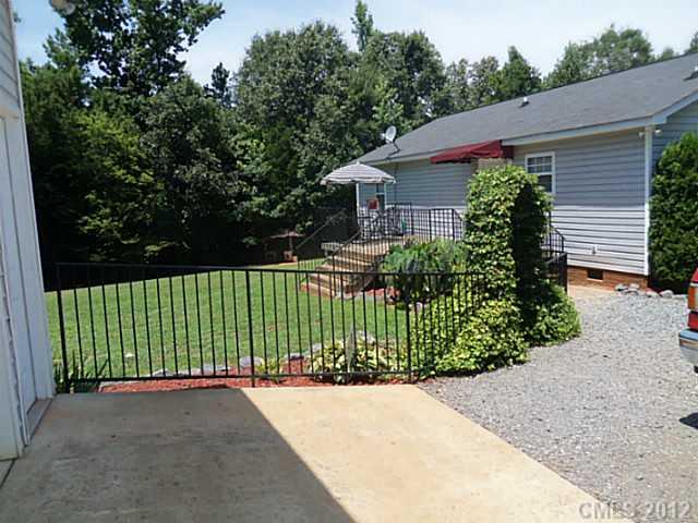 4841 Old Hickory Road, Unit 1 Lancaster, SC 29720 - Photo 11 of 11 a view of a garden with plants and large trees