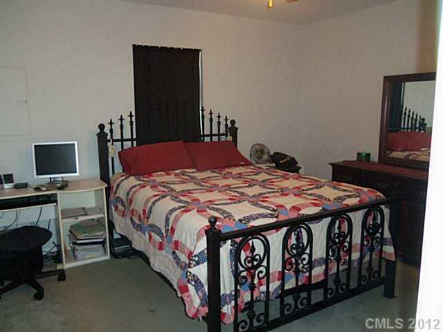 4841 Old Hickory Road, Unit 1 Lancaster, SC 29720 - Photo 4 of 11 a bedroom with a bed and a flat screen tv