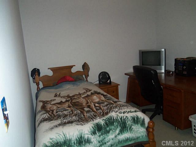 4841 Old Hickory Road, Unit 1 Lancaster, SC 29720 - Photo 6 of 11 a bed sitting in a bedroom next to a window