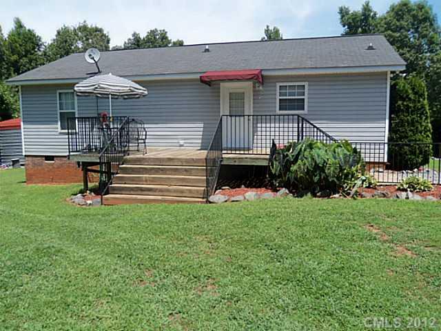 4841 Old Hickory Road, Unit 1 Lancaster, SC 29720 - Photo 7 of 11 a front view of a house with a garden