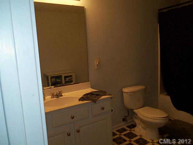 4841 Old Hickory Road, Unit 1 Lancaster, SC 29720 - Photo 8 of 11 a bathroom with a toilet and a sink