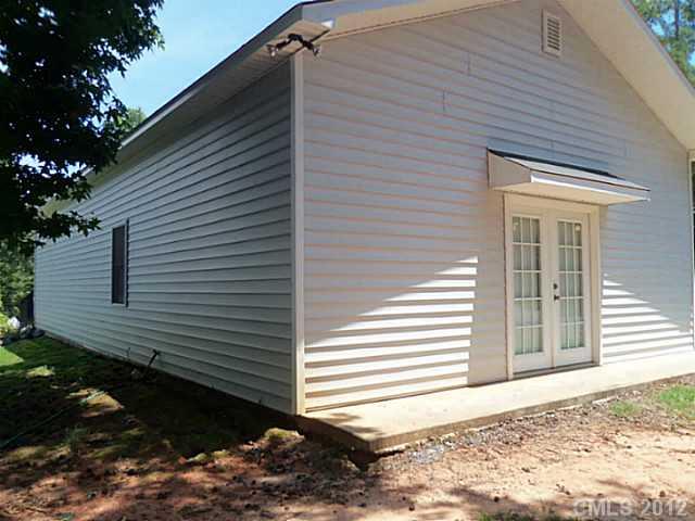 4841 Old Hickory Road, Unit 1 Lancaster, SC 29720 - Photo 10 of 11 a side view of a house with a yard