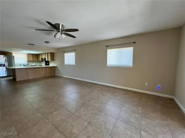 a view of a livingroom with furniture and a window