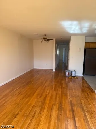 a view of a room with a wooden floor