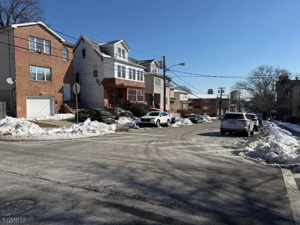 a view of a street with cars