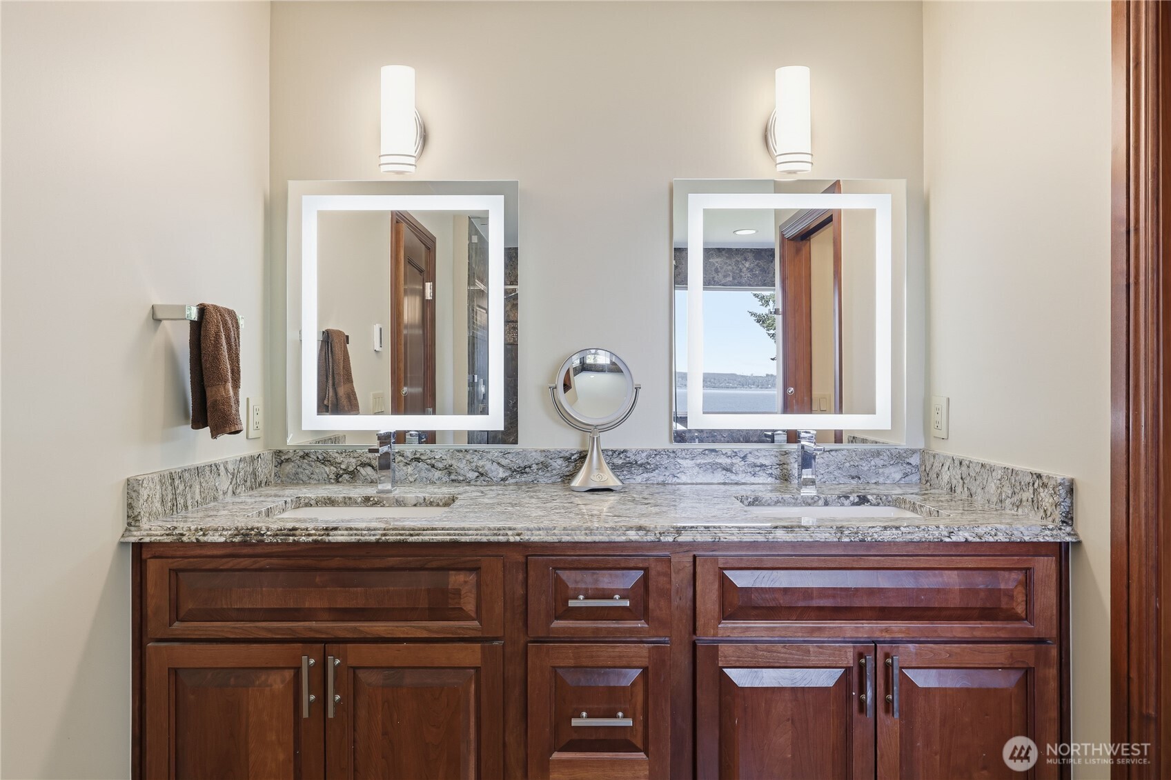 1411 Thorndyke Road Port Ludlow, WA 98365 - Photo 32 of 40 a bathroom with a granite countertop sink and a mirror