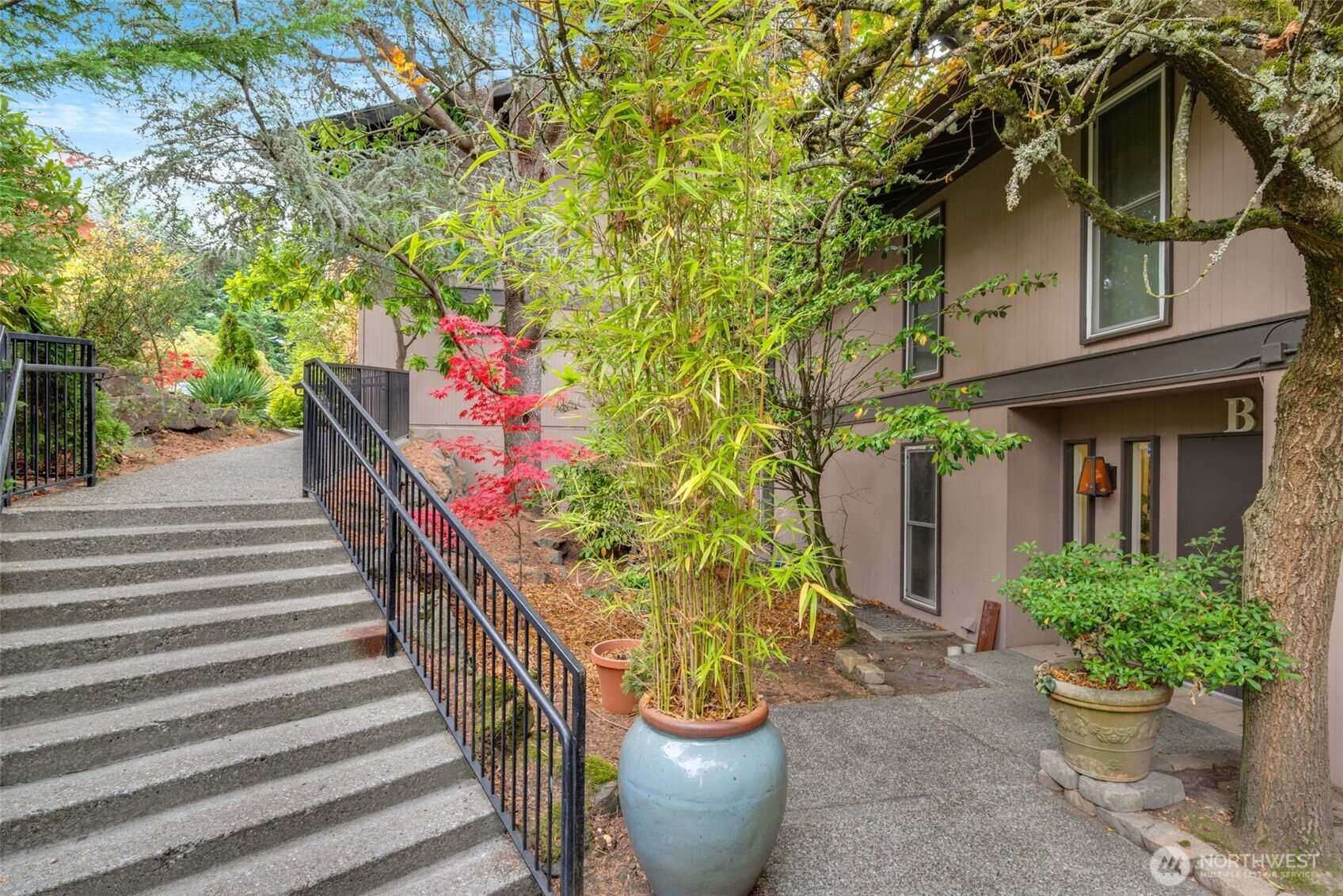 1425 South Puget Drive, Unit B3 Renton, WA 98055 - Photo 1 of 24 a view of a house with potted plants
