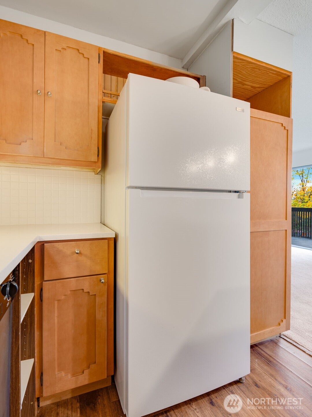 1425 South Puget Drive, Unit B3 Renton, WA 98055 - Photo 12 of 24 a white refrigerator freezer sitting in a kitchen