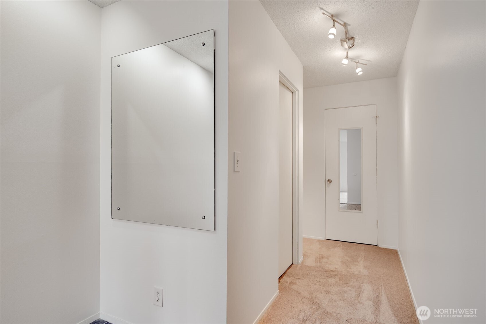 1425 South Puget Drive, Unit B3 Renton, WA 98055 - Photo 13 of 24 an empty room with chandelier fan