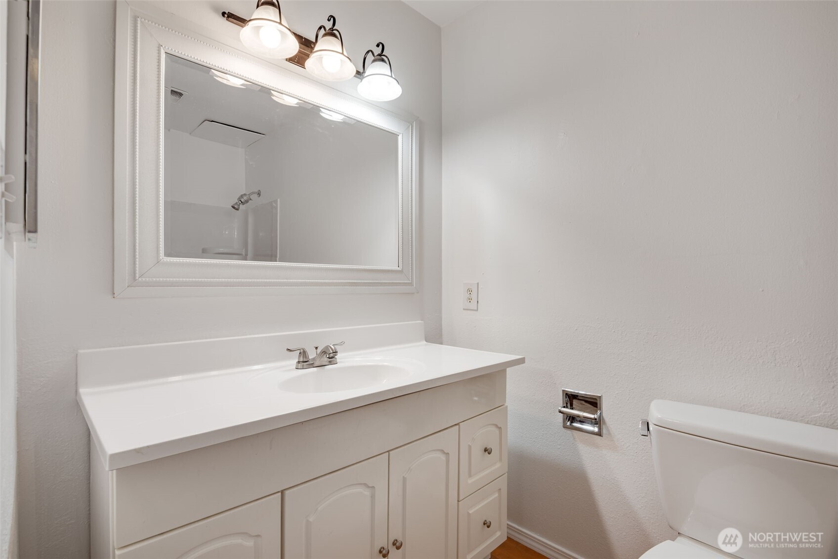1425 South Puget Drive, Unit B3 Renton, WA 98055 - Photo 17 of 24 a bathroom with a sink vanity and a mirror