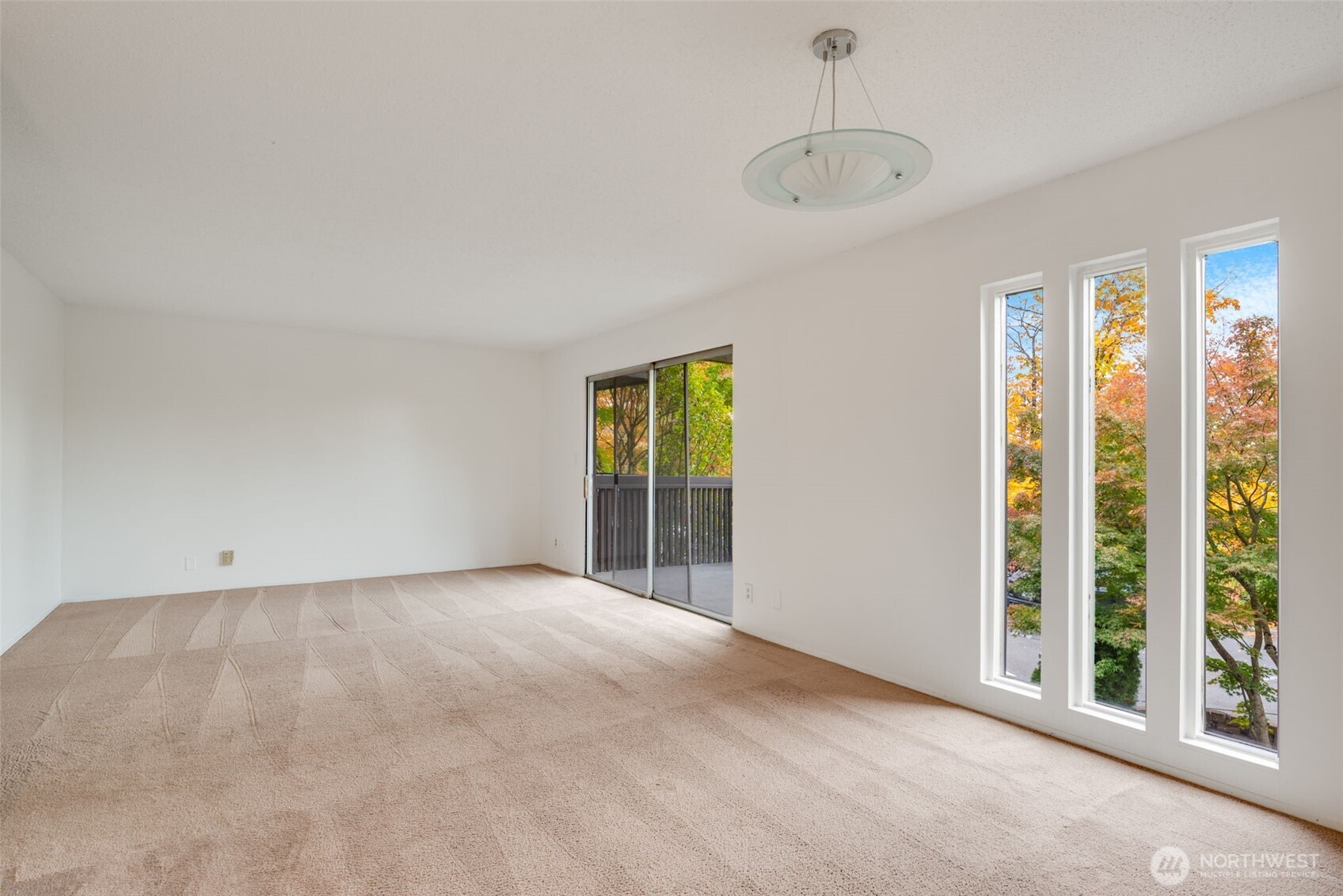 1425 South Puget Drive, Unit B3 Renton, WA 98055 - Photo 4 of 24 a view of an empty room with a window
