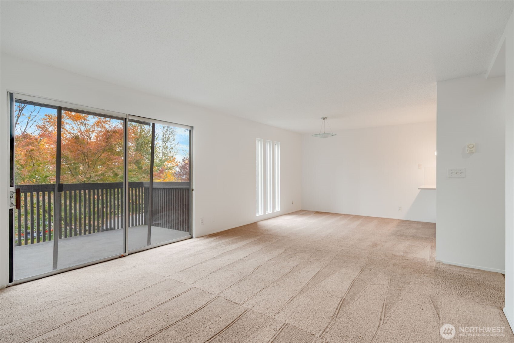 1425 South Puget Drive, Unit B3 Renton, WA 98055 - Photo 7 of 24 a view of a room with sliding glass door