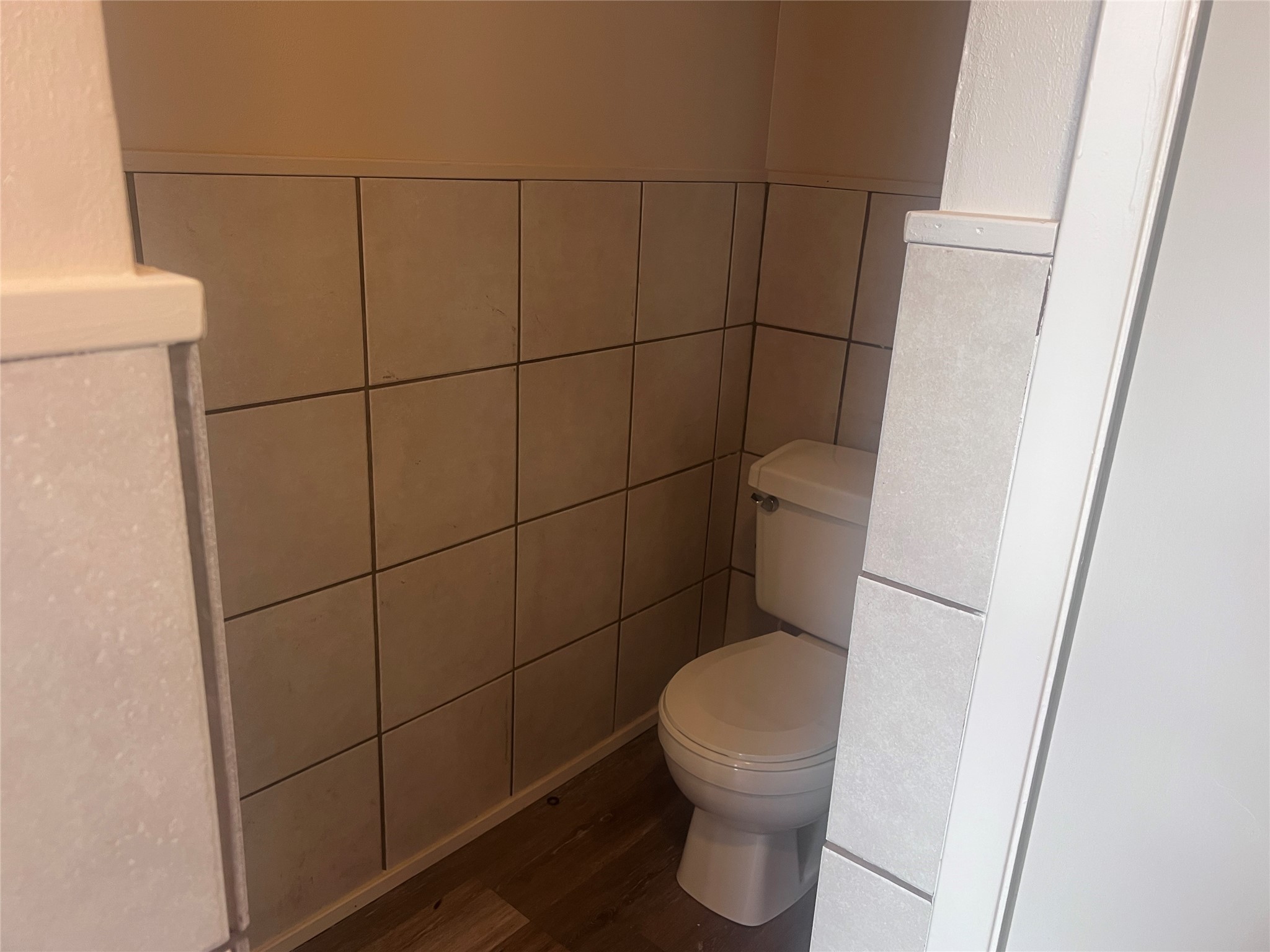 620 Koehl Street Wharton, TX 77488 - Photo 16 of 37 a white toilet sitting next to a bathroom sink