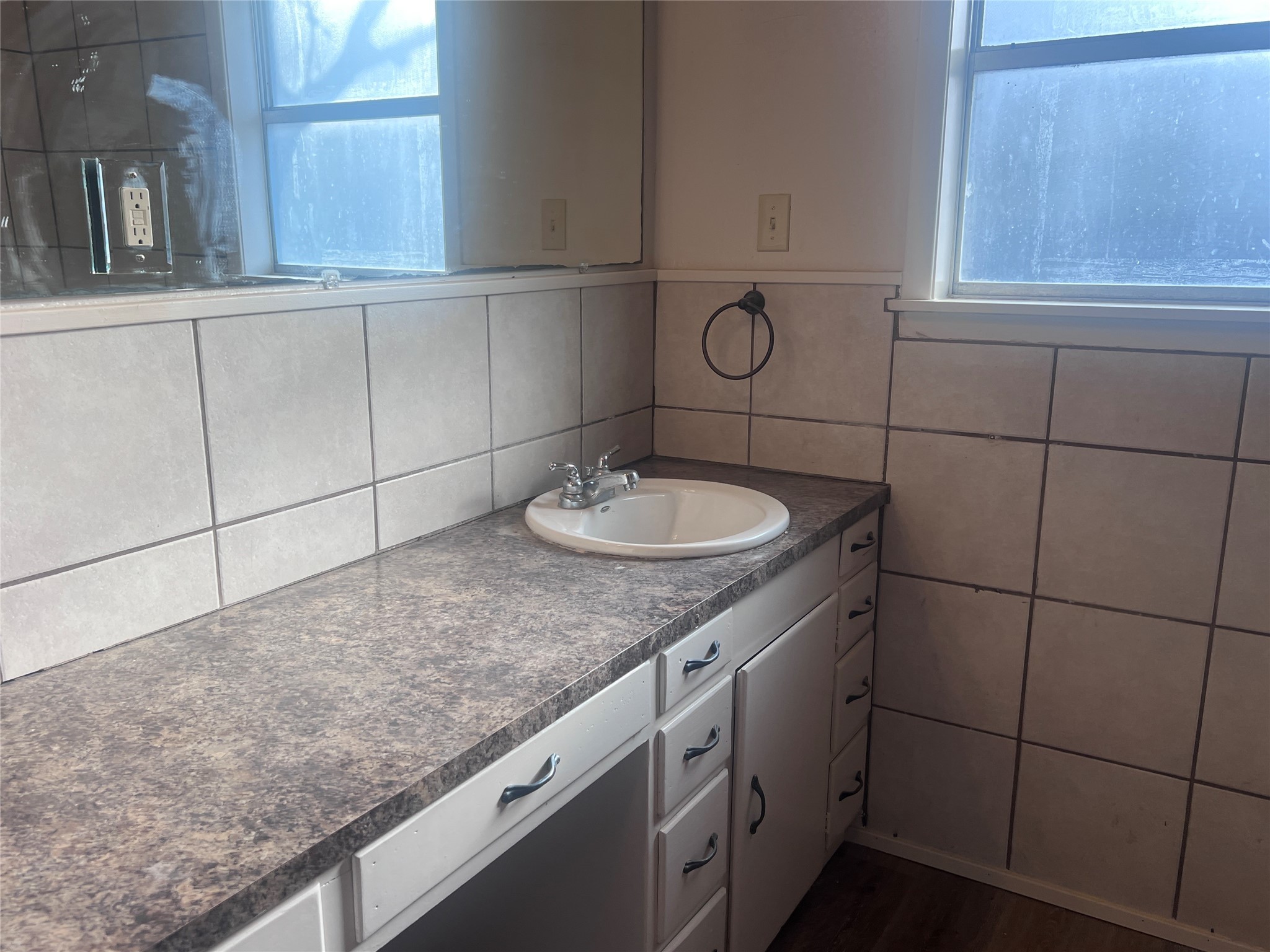 620 Koehl Street Wharton, TX 77488 - Photo 17 of 37 a bathroom with a granite countertop sink and a mirror