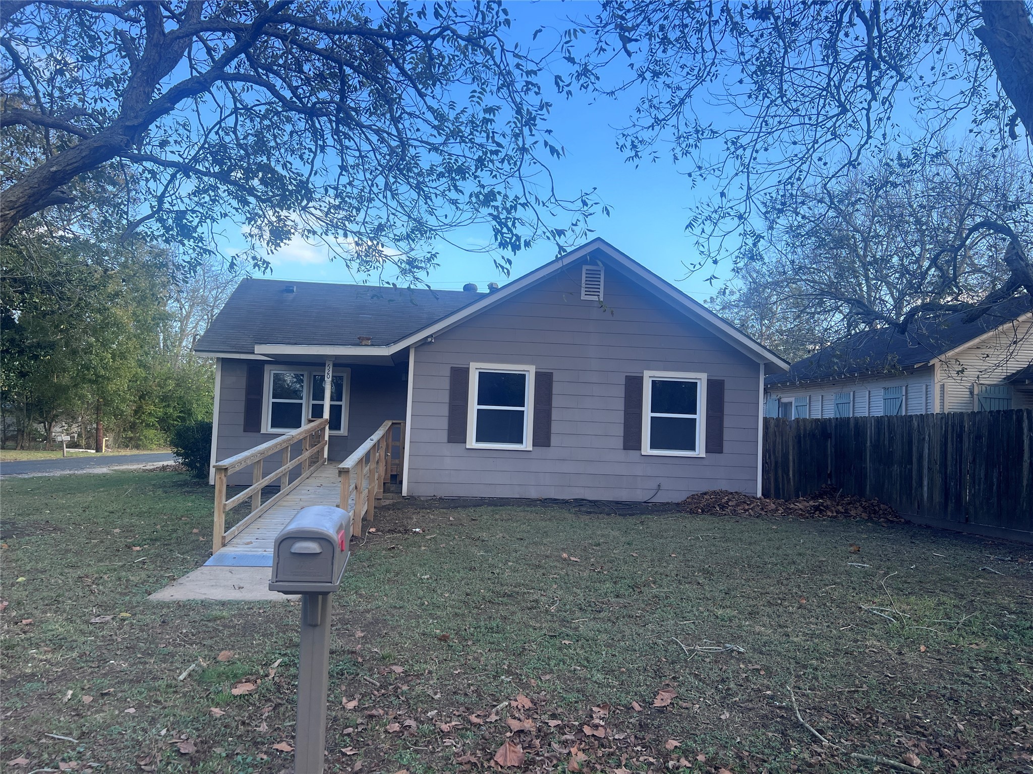 620 Koehl Street Wharton, TX 77488 - Photo 2 of 37 a house is sitting in middle of the forest