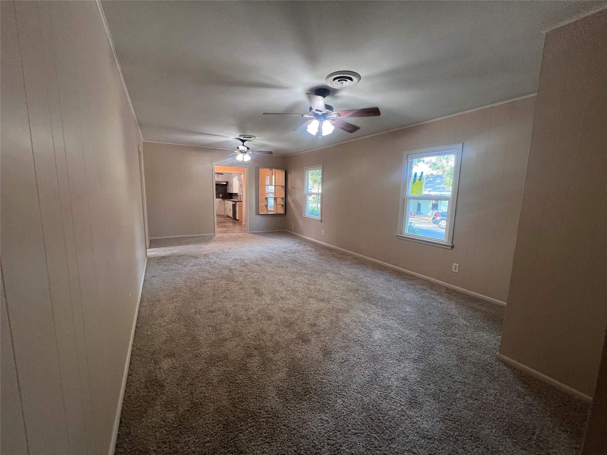 620 Koehl Street Wharton, TX 77488 - Photo 28 of 37 en empty room with windows and ceiling fan