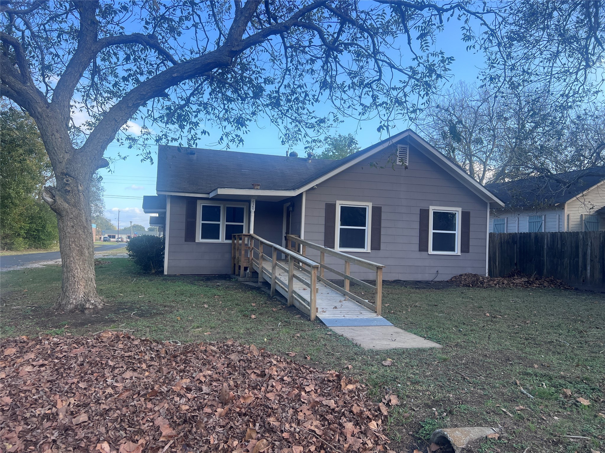 620 Koehl Street Wharton, TX 77488 - Photo 3 of 37 a house with a tree in front of the house