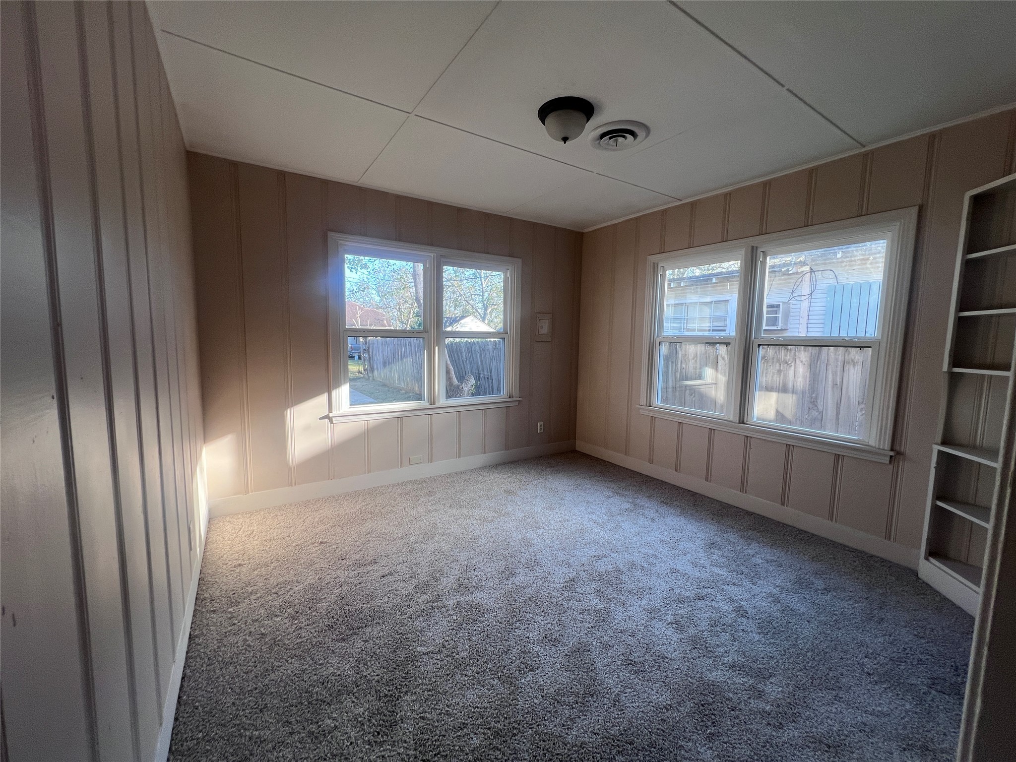 620 Koehl Street Wharton, TX 77488 - Photo 32 of 37 an empty room with windows and closet