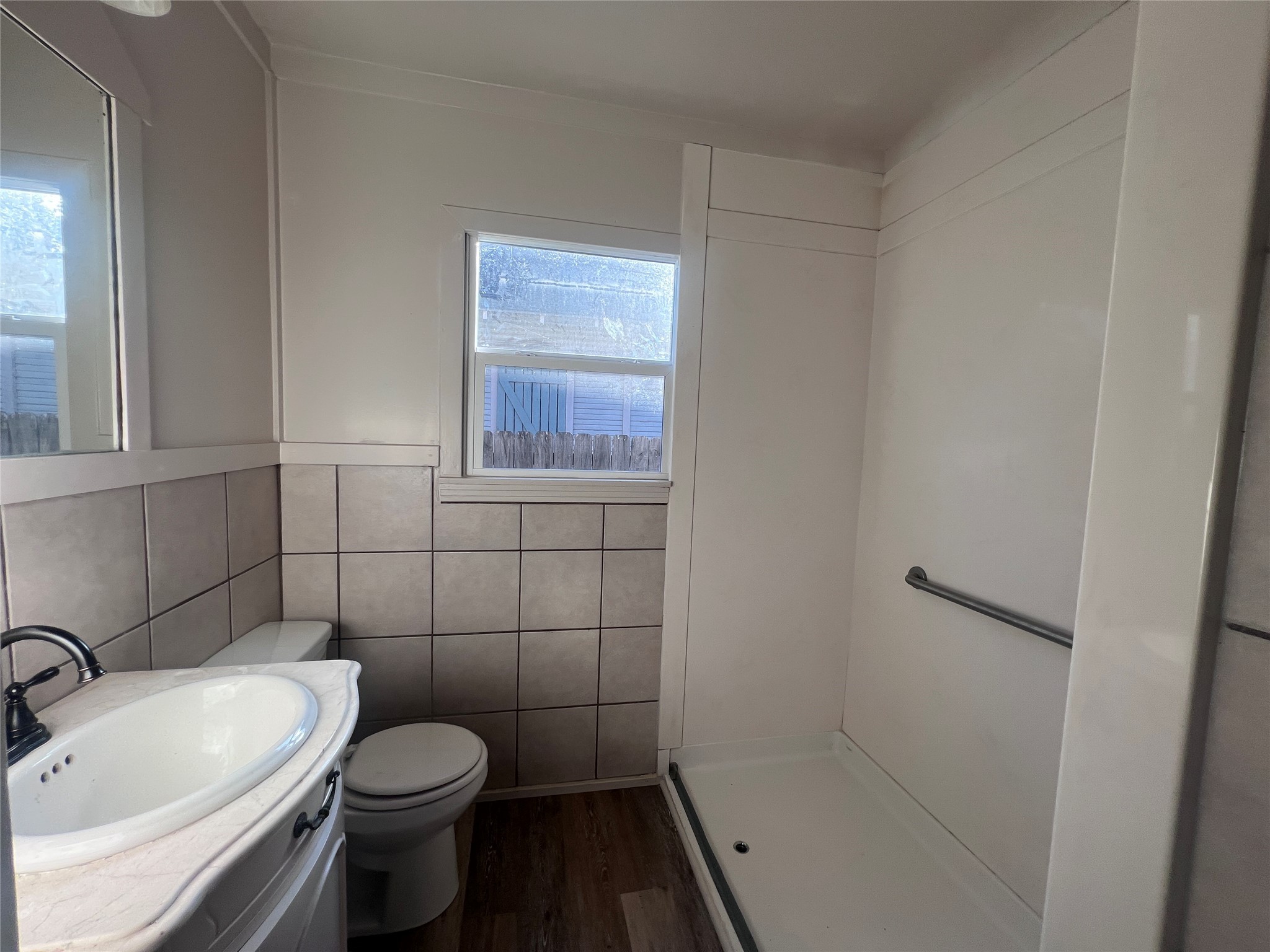 620 Koehl Street Wharton, TX 77488 - Photo 34 of 37 a white toilet sitting next to a bathroom sink