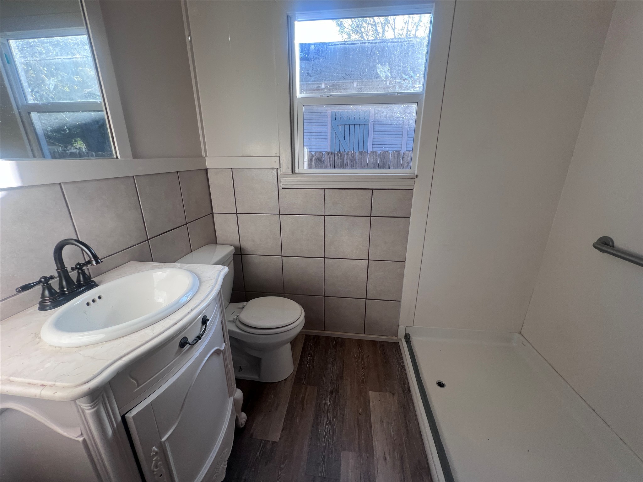 620 Koehl Street Wharton, TX 77488 - Photo 35 of 37 a bathroom with a sink and a mirror