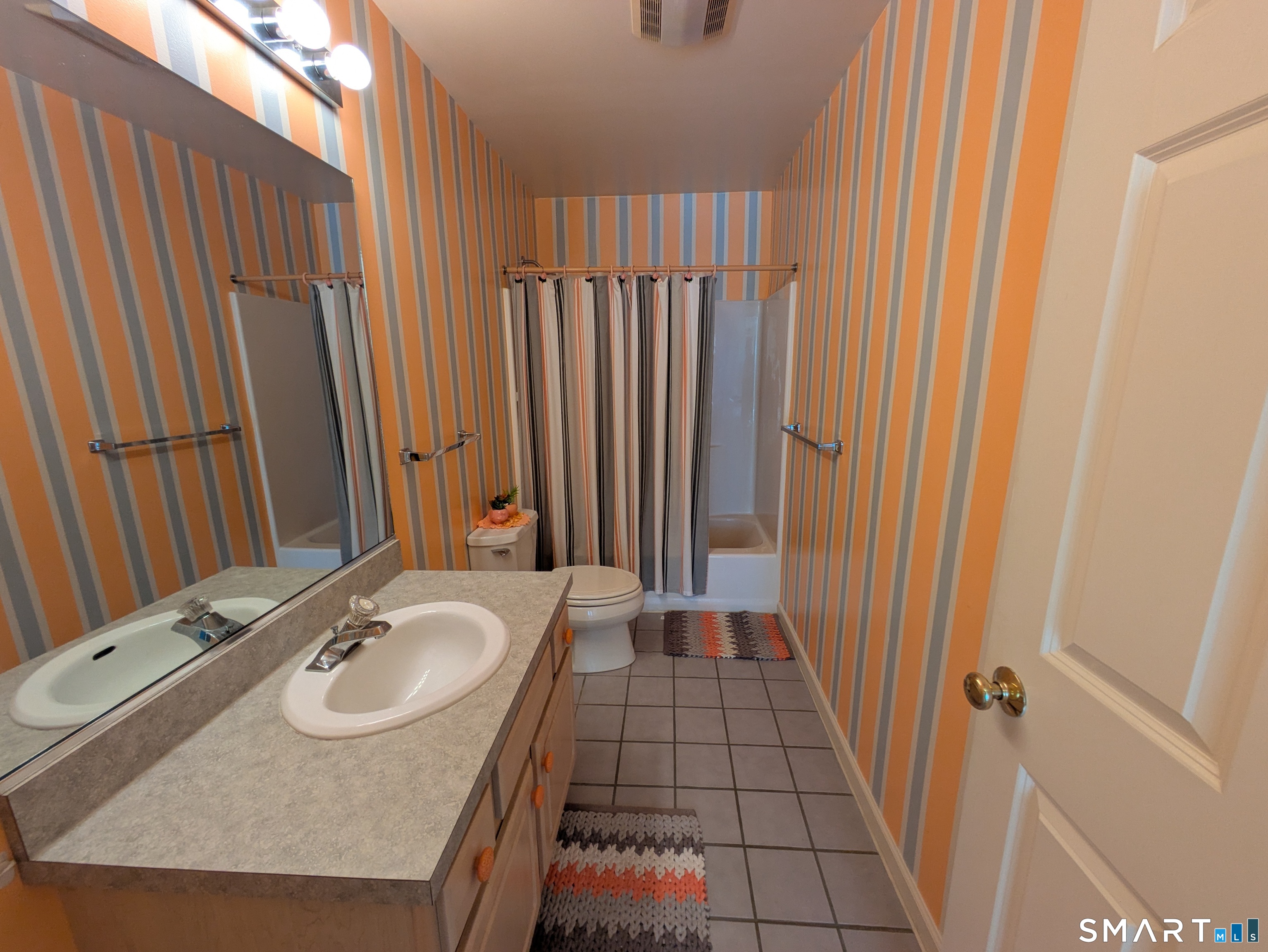 61 Basking Brook Road Shelton, CT 06484 - Photo 18 of 25 a bathroom with a sink a mirror and a shower