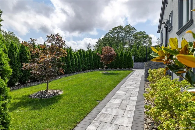 a view of a backyard with sitting area