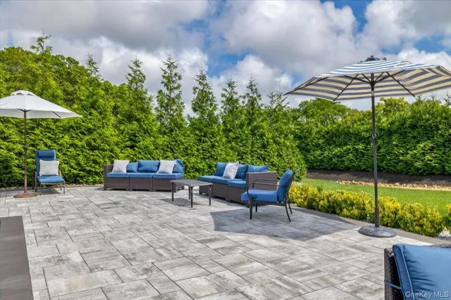 a view of a green field with wooden fence
