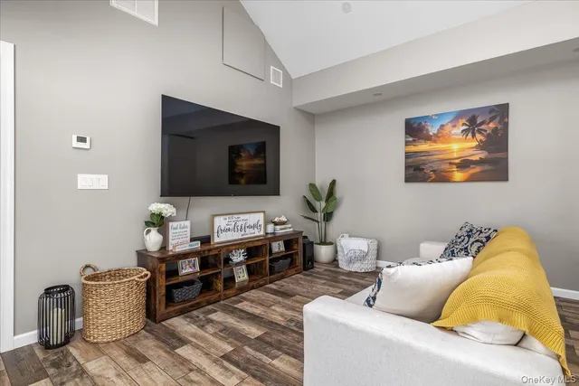 a bedroom with a bed and a potted plant