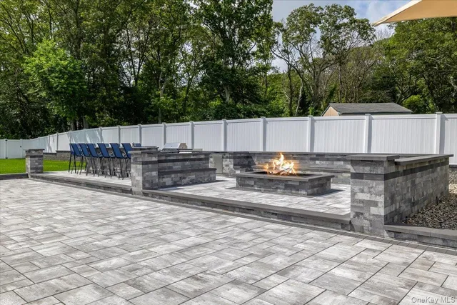 a view of a swimming pool with a couches in a patio