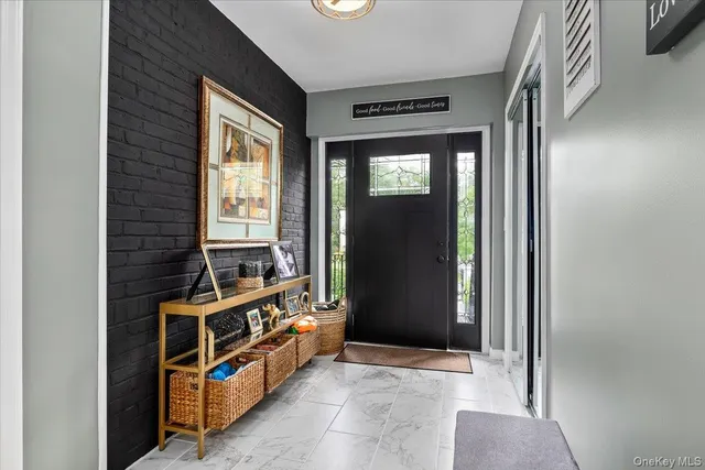 a view of an entryway with front door