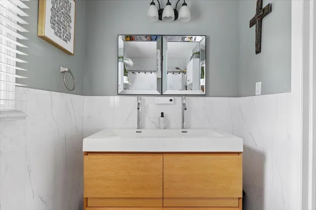a bathroom with a sink and a mirror